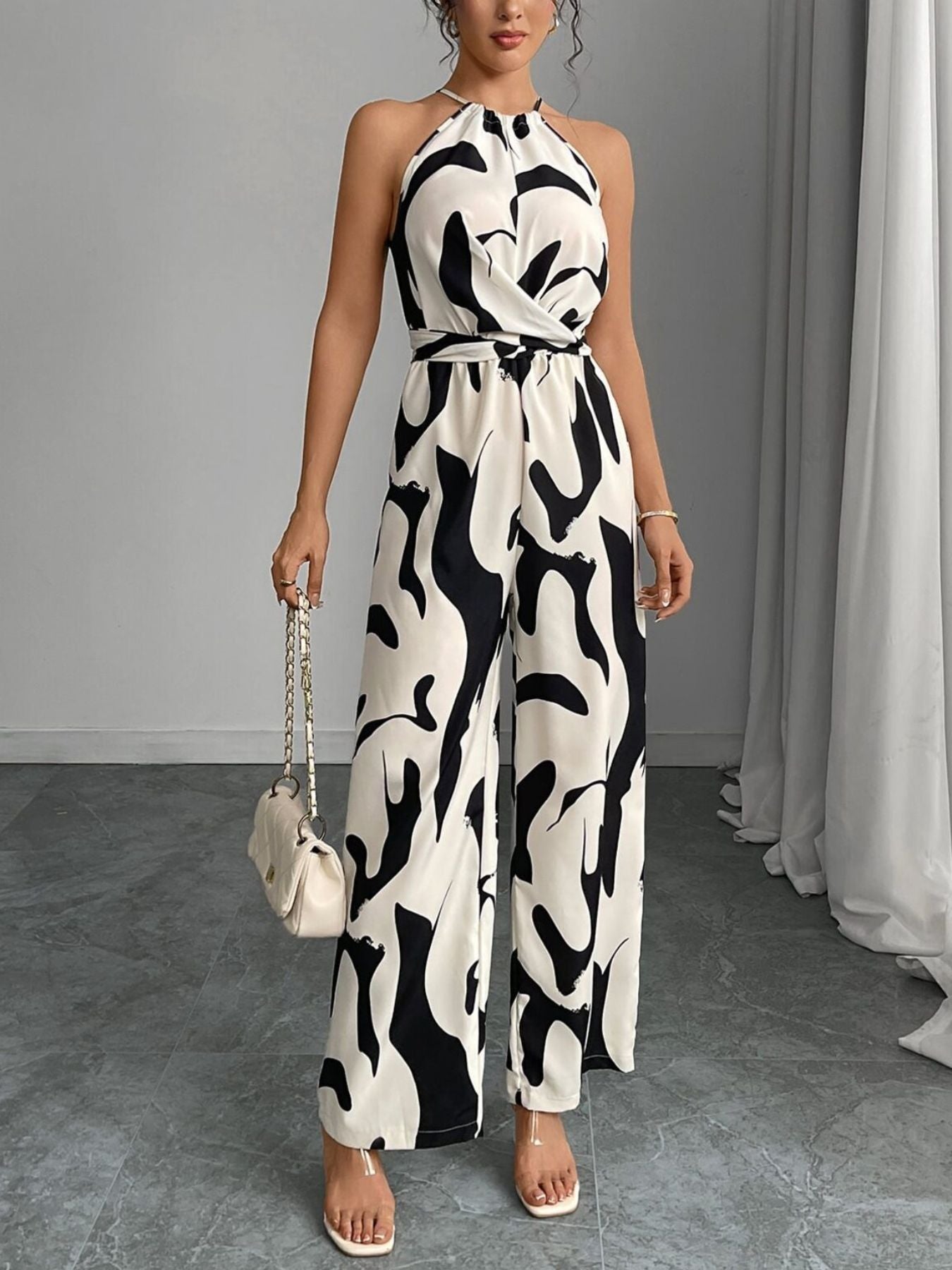 Elara | Women's Abstract Print Halter Neck Tie Waist Wide Leg Jumpsuit
