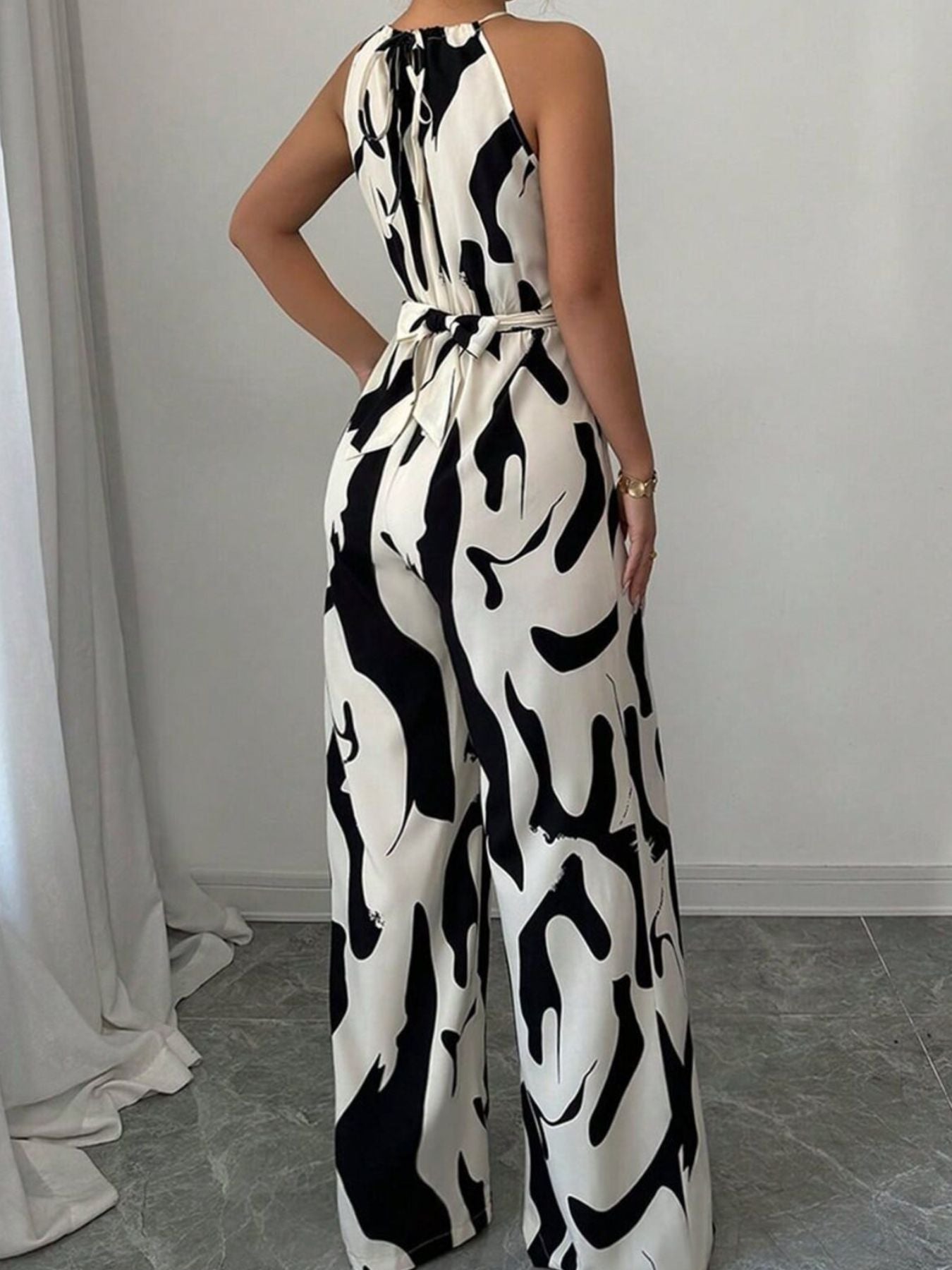 Elara | Women's Abstract Print Halter Neck Tie Waist Wide Leg Jumpsuit